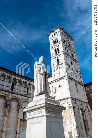 Panoramic view of Chiesa di San Michele in Foro in the historic center of Lucca Italy on a sunny summer day with clear blue sky and warm light on the ancient architecture Panoramic view of Chiesa di San Michele in Foro in the historic center of Lucca Italy on a sunny summer day with clear blue sky and warm light on the ancient architecture 129502702