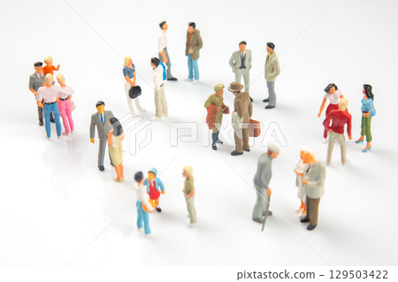 Miniature people gathering in a lively urban setting during daytime social interactions 129503422