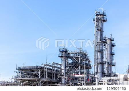 Oil and Gas refinery petrochemical plant industrial on blue sky background, Oil and Gas refinery petrochemical plant pipeline steel, Oil and Gas refinery factory maintenance, Global energy refinery. Oil and Gas refinery petrochemical plant industrial on blue sky background, Oil and Gas refinery petrochemical plant pipeline steel, Oil and Gas refinery factory maintenance, Global energy refinery. 129504460