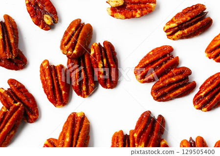 Delicious salted pecan nuts scattered. 129505400