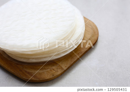 Stacked round sheets of Vietnamese rice paper 129505431