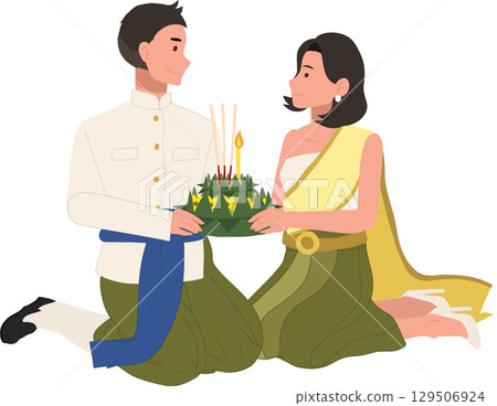 thai cultural festival scene with couple kneeling in traditional attire holding krathong for loy krathong celebration in thailand 129506924