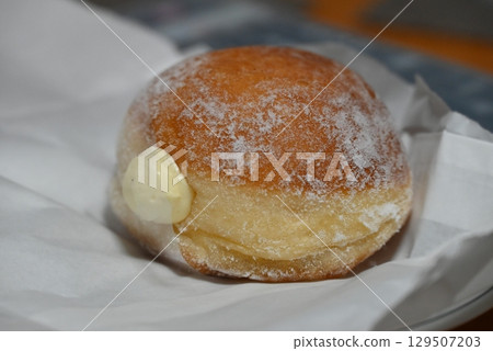 Deep fried bread filled with fresh cream Deep fried bread filled with fresh cream 129507203