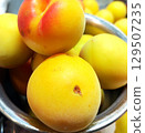 Beauty in imperfection – Naturally ripe Nanko plums with traces of hail damage. 129507235