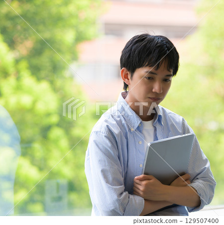 A conversation between a worried male student and a woman A conversation between a worried male student and a woman 129507400