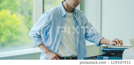 A man taking a copy A man taking a copy 129507431