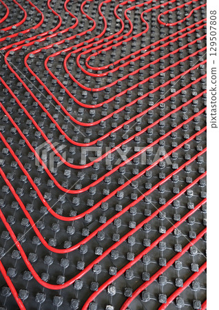 Tubes of radiant underfloor heating installation 129507808