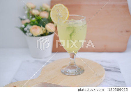 Homemade Fresh Lemon Juice on Wooden Board Homemade Fresh Lemon Juice on Wooden Board 129509055