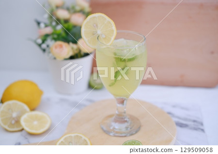 Homemade Fresh Lemon Juice on Wooden Board 129509058