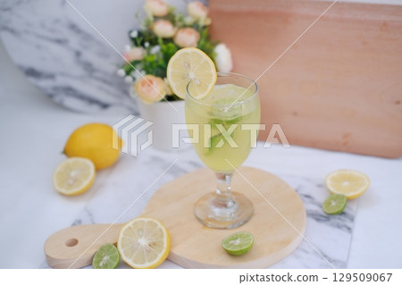 Homemade Fresh Lemon Juice on Wooden Board 129509067