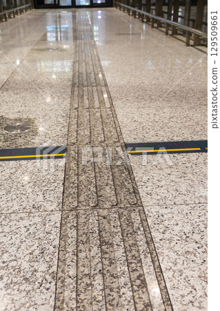 Various indoor floor tiles with tactile to aid visually impared person find their way. 129509661