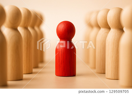 Red Peg, glossy red peg between two rows of smooth light wood pegs on white surface with clean bright studio lighting 129509705