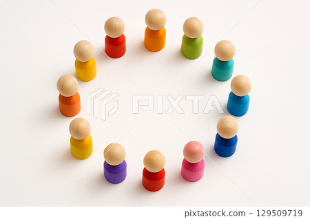 Wooden peg figurines in a colorful gradient arranged in a partial circle to promote diversity, equity, and inclusion Wooden peg figurines in a colorful gradient arranged in a partial circle to promote diversity, equity, and inclusion 129509719