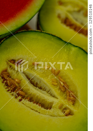 Cut in half cantaloupe melon isolated on white background Cut in half cantaloupe melon isolated on white background 129510146