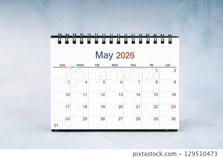 May 2026 Monthly desk calendar on vintage wall, Front view. 129510473