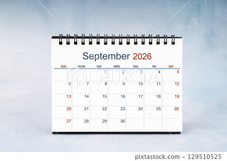 September 2026 Monthly desk calendar on vintage wall, Front view. 129510525