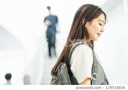 A woman going out alone with a backpack A woman going out alone with a backpack 129510838