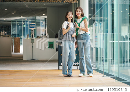 Young woman going shopping with friends 129510843