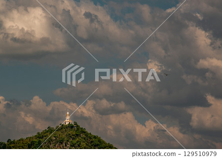 Wat Tham Khao Prathun that receives on beautiful sun On the top of the hill. 129510979