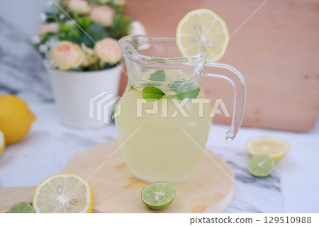 Fresh Lemonade in Glass Pitcher with Mint 129510988