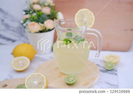 Fresh Lemonade in Glass Pitcher with Mint 129510989
