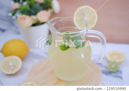 Fresh Lemonade in Glass Pitcher with Mint 129510990