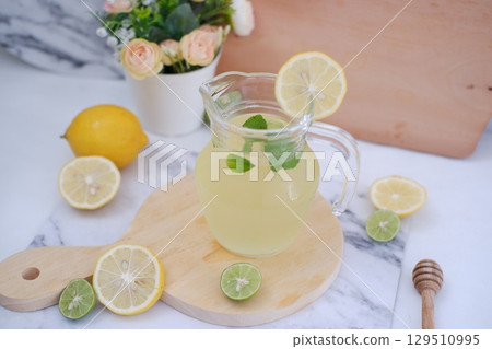 Fresh Lemonade in Glass Pitcher with Mint Fresh Lemonade in Glass Pitcher with Mint 129510995