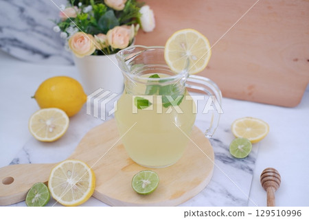Fresh Lemonade in Glass Pitcher with Mint Fresh Lemonade in Glass Pitcher with Mint 129510996