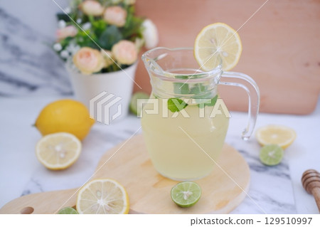 Fresh Lemonade in Glass Pitcher with Mint 129510997