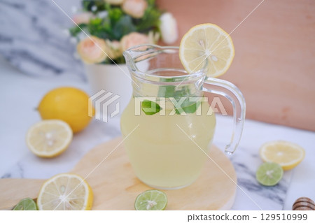 Fresh Lemonade in Glass Pitcher with Mint 129510999