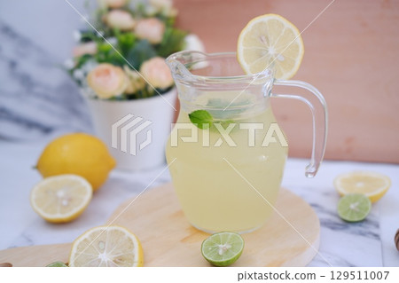 Fresh Lemonade in Glass Pitcher with Mint 129511007