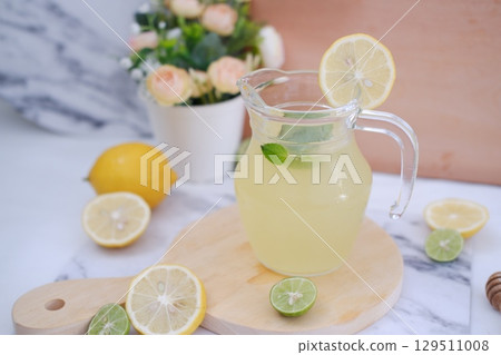 Fresh Lemonade in Glass Pitcher with Mint 129511008