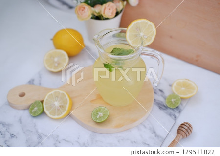 Fresh Lemonade in Glass Pitcher with Mint Fresh Lemonade in Glass Pitcher with Mint 129511022