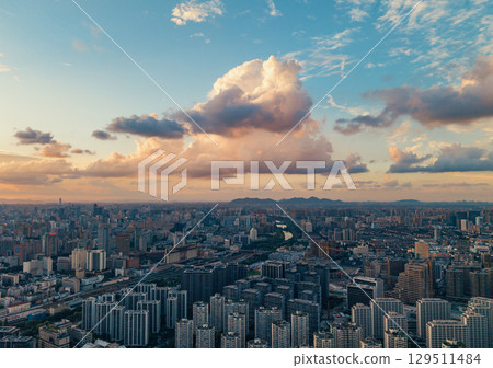 Aerial view of Hangzhou City skyline at sunset with colorful clouds Aerial view of Hangzhou City skyline at sunset with colorful clouds 129511484