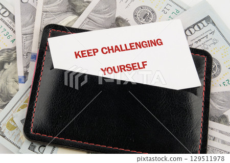 Personal growth concept. Words KEEP CHALLENGING YOURSELF 129511978