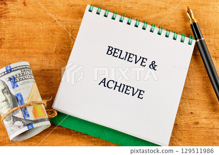 Inspiration quotes concept. BELIEVE and ACHIEVE words Inspiration quotes concept. BELIEVE and ACHIEVE words 129511986