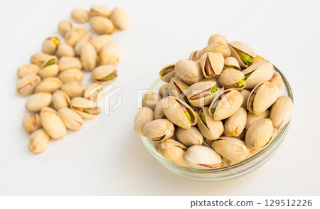 roasted pistachios on white background 129512226