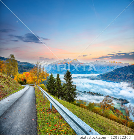 Amazing  autumn view of lake meadows trees and mountains in Sell Am See 129512263