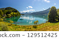 Lake Wolfgangsee with sailing boats, sailboat anchored in a calm lake bay, Alps, Austria 129512425