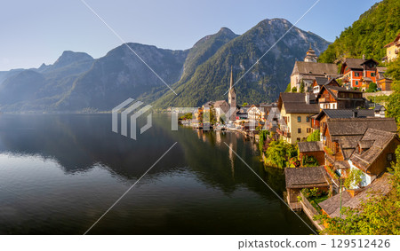 Hallstatt on Lake Hallstatt, a beautiful historic small town on the shore of a lake between mountains, Austria 129512426