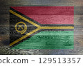 A Vanuatu flag on rustic old wood surface background 129513357