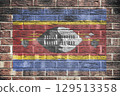 Eswatini Swaziland flag on a brick wall background 129513358