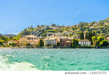 Old houses building architecture on lake Como, Italy. Blue wave 129515772