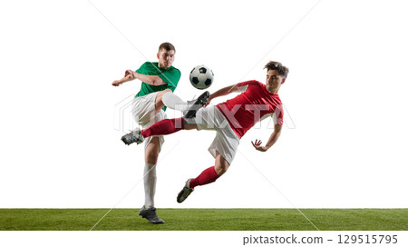 Soccer players kicking ball in midair during match 129515795