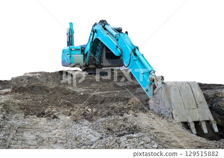 A large excavator is working in a workplace, isolated on a white background. A large excavator is working in a workplace, isolated on a white background. 129515882