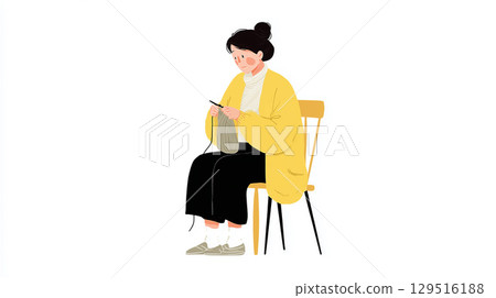 一位身穿黃色羊毛衫的年輕女子正坐在椅子上專心編織。 一位身穿黃色羊毛衫的年輕女子正坐在椅子上專心編織。 129516188