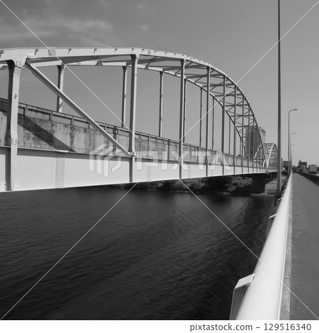 A view of the Tama River private bridge and the blue sky. 129516340