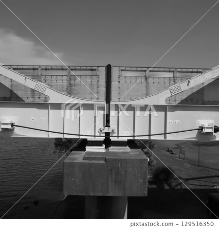 A view of the Tama River private bridge and the blue sky. 129516350