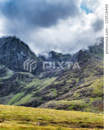 Viewing Carrauntoohill mountain peak shrouded in clouds on popular walkway, Ireland. Viewing Carrauntoohill mountain peak shrouded in clouds on popular walkway, Ireland. 129516460