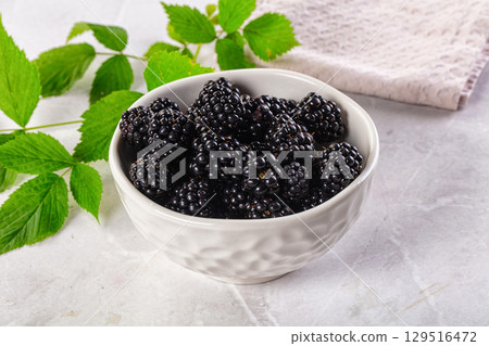 Raw sweet juicy blackberry in the bowl 129516472